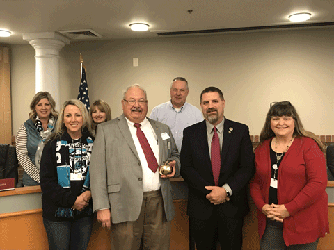 WB Mark Conlee and Bro. Dan White along with the members of the Sumner-Bonney Lake School Board and members of the district staff.