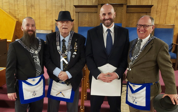 Johnny is pictured with, from left to right, SD Benjamin Fuller, WM Russ Sutton, Brother Nuchols and WB Scott Thompson, who conferred the degree.
